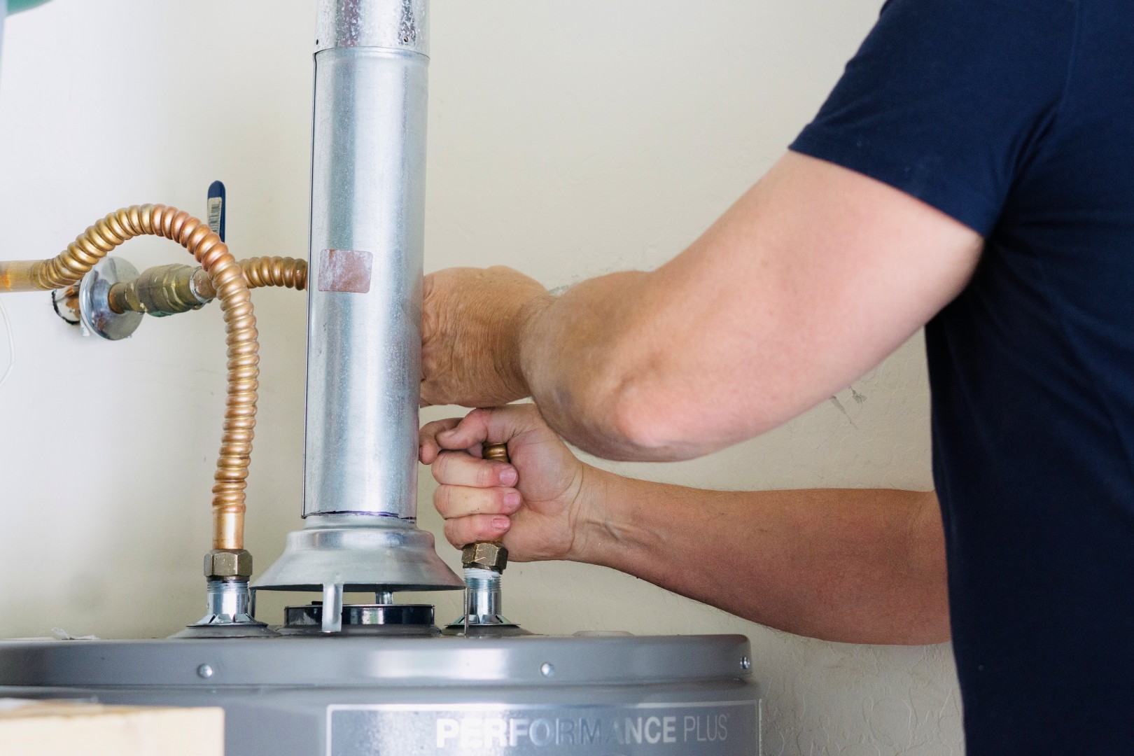 plumber installing a water heater