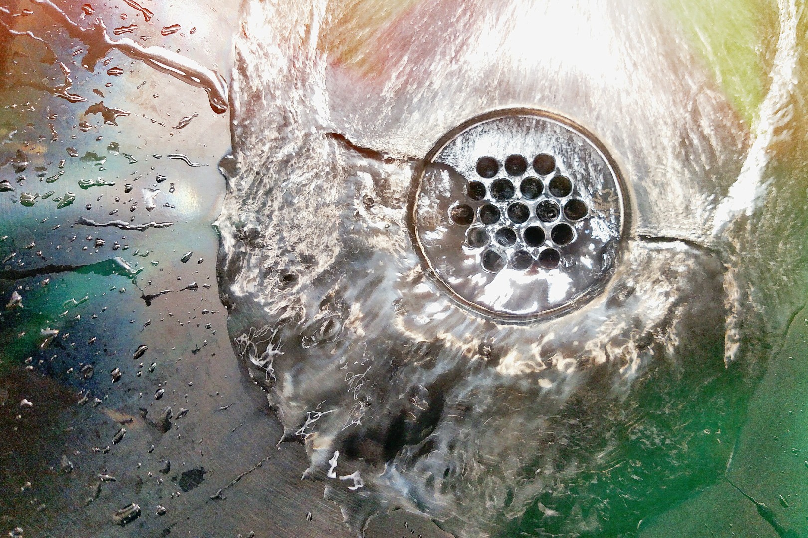 water swirling down a drain